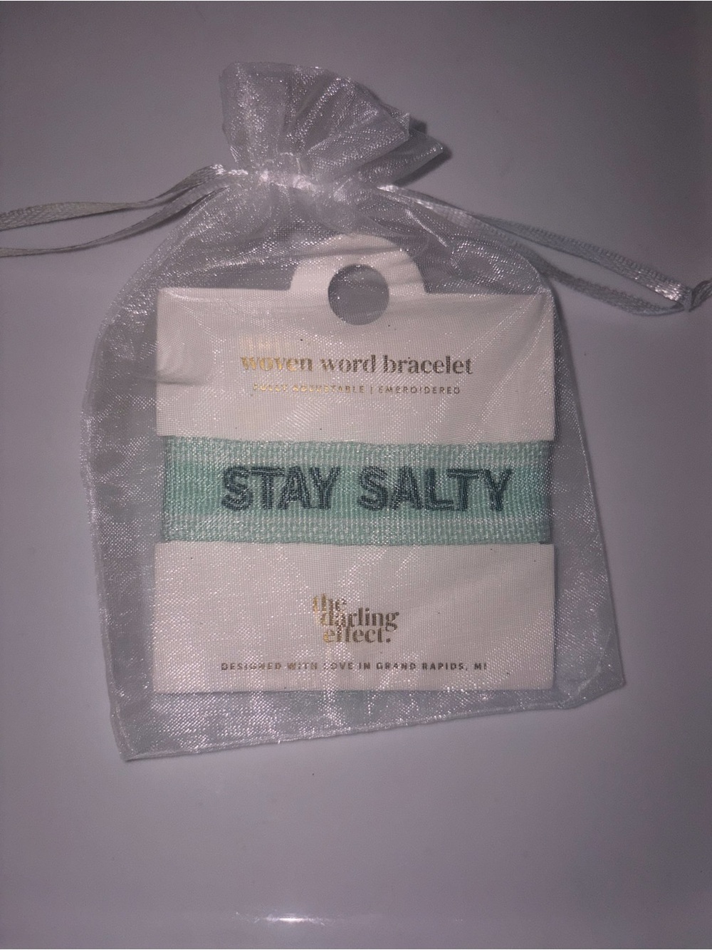 The Darling Effect woven bracelet features embroidered "STAY SALTY"